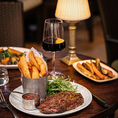the river grille restaurant in the Bristol hotel featuring a delicious steak