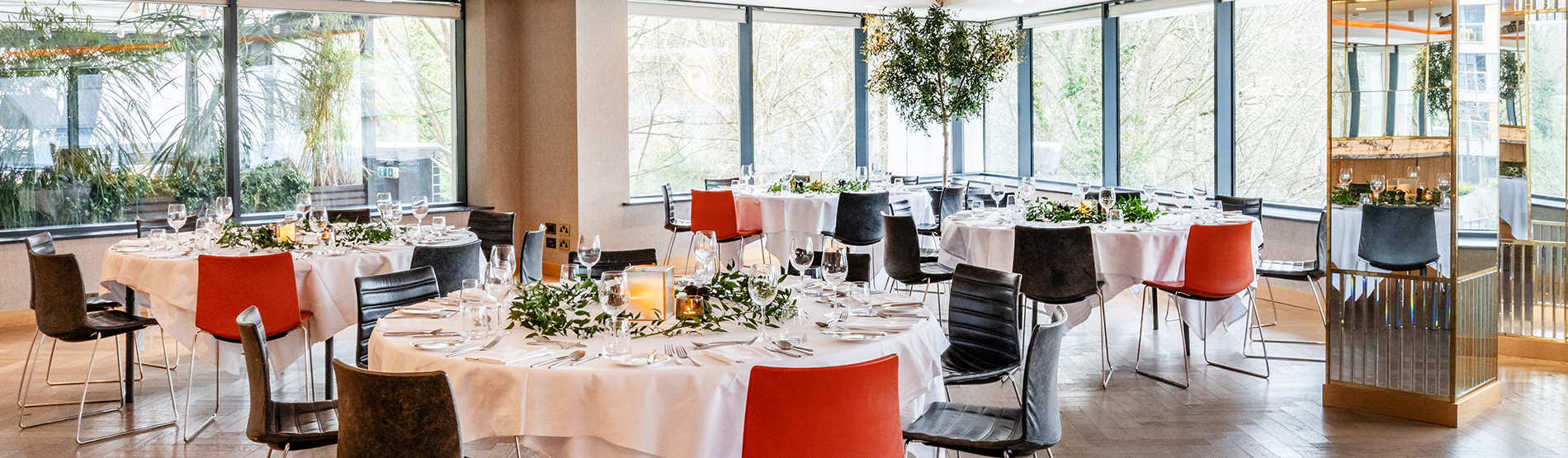 A beautifully arranged restaurant room at The River Lee Hotel in Cork, set up for a meeting or event. The space is elegantly decorated, with tables and chairs neatly organized, ready to host a corporate event, board meeting, brand launch, or special celebration. 