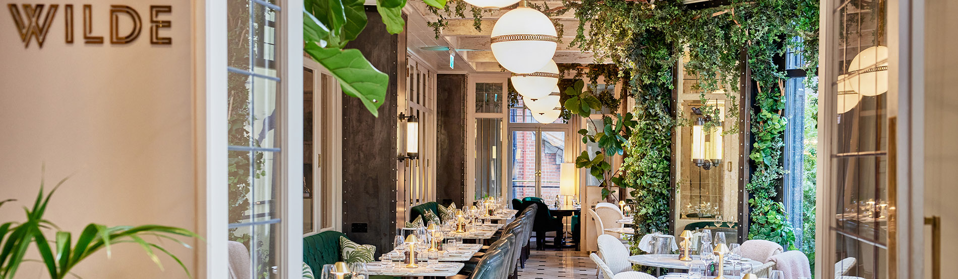 Promotional banner for dining at Wilde, The Westbury’s modern restaurant in Dublin with elegant interiors.